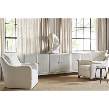 HC4600-C3 Textures Six Door Credenza shown in optional Weathered White paint
with F5 Reeded Doors, SL Saber Legs, N2 Antique Bronze Drop Pull and P2 Centered
on Inner Edge Door placement, HC9509-SW Jules Swivel Chair with B3-Upholstered
Base, AR3-Saddle Arm and in fabric HC401-10, HC9509-CH Jules Chair with AR4-
Key Arm, B2-Tapered Leg Base shown in optional Ebony finish, in fabric HC401-10 and
with NP-09 nail head trim at arm and base, HC5388-10 Grace Spot Table Base and
HC8030-01 Grace Bowl.