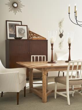 Room Scene: HC1544-70W Piedmont 90” Dining Table, shown in Natural finish; HC1305-02 Jardin Dining Side Chair, fabric HC2399-16, shown in Swedish White finish; HC1509-23 Chastain Chair, fabric COM, shown in Tawny finish; HC1545-70 Blackland Cabinet, shown in Tawny finish.