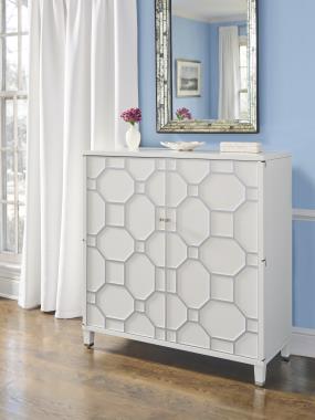 Room Scene: HC1544-70 Blackland Cabinet shown in Dove White paint with optional Solid Silver Stripe on fret and Silver casters and hardware 