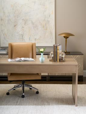 Room Scene: HC4601-DC – Mr. Ashford Desk Chair shown in HC147 leather; HC5394-70 - Harrison Four-Drawer Desk shown in Weathered Stone finish; HC5390-70 - Harrison File Cabinet shown in Weathered Stone finish; HC9571-70 - Remy Wood base shown in Pyrite finish; HC9572-70 - Remy 2 Door Upholstered Cabinet shown in HC4518-18 fabric with Pyrite finish and HC9573-70 - Remy 3 Drawer Upholstered Chest shown in HC9004-92 fabric with Pyrite finish.