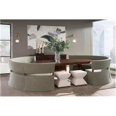 Room Scene: HC4607-72 - Luna Quarter-Turn Banquette shown in HC480-72 fabric with Truffle finish; (2) HC185-71- Ingold Three Leg Pedestal Bases with HC180-71 Ingold Oval Expansion Top shown in Truffle finish; HC6445-70 - Amelia Sideboard shown in Java finish and HC9502-29 - Serge Ottoman shown in HC379-91 fabric with Truffle finish.