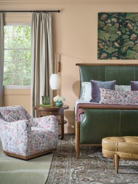 Room Scene: HC8662-10 Maren King Bed shown in HC146 leather and Truffle finish, HC8531-27 Luca Swivel Chair shown in HC483-73 fabric and Chestnut finish, HC8583-70 Beatrice Side Table shown in Truffle finish and HC8509-29 Fannie Ottoman shown in HC147 leather and Hable Grey finish.