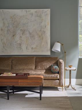 Room Scene: HC9003-88 Vero Sofa shown in HC273-82 with HC806-74 on bolsters,  HC126-30 Bexley Cocktail Ottoman shown in HC922 leather with Black Pearl nail trim and Kohl finish and HCP9143-STK Adair Spot Table.