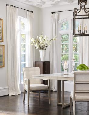 Room Scene: HC3444-10W Hatton Dining Table shown in optional Chalk paint top with Lynx paint base, HC3427-01 Griswold Arm Chair and HC3427-02 Griswold Side Chair shown in fabric HC249-10 and in optional Lynx paint, HC8015-10 L'Arpege Candle Holder, HC8035-10 Ysidro Large Hurricane.