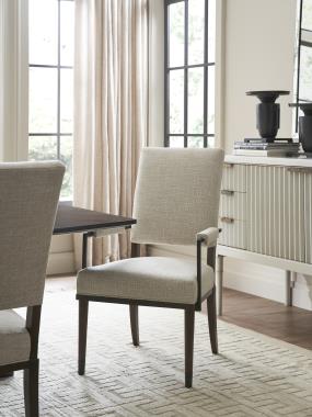Room Scene: HC7340-10 Clipse Dining Table shown in standard Truffle finish, HC7223-01 Aldrick Arm Chair and HC7223-02 Aldrick Side Chair shown in optional Java finish and in fabric HC310-12 and HC7247-70S Petite Plaited Buffet with Royal White Marble Top shown in optional Chalk paint.