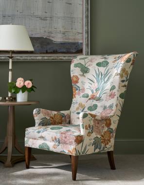 Room Scene: Hc8500-55 Bird Wing Chair shown in fabric HC802-99-LIBERTY with Truffle finish and HC9186-70 Wales Side Table shown in Weathered Mineral finish.